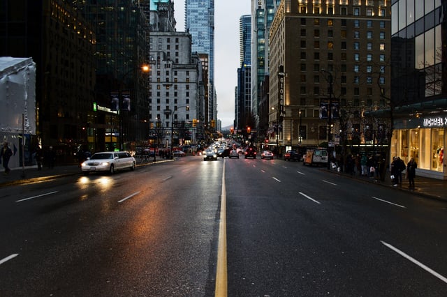 Downtown-Denver-Street-With-Cars-Headlights.jpg