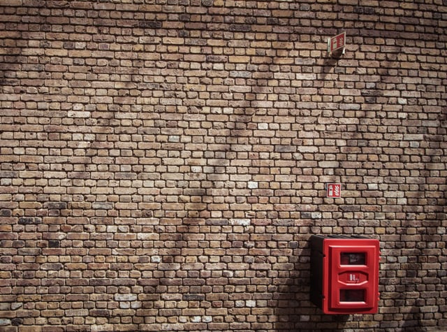 brown_brick_wall_with_fire_extinguisher